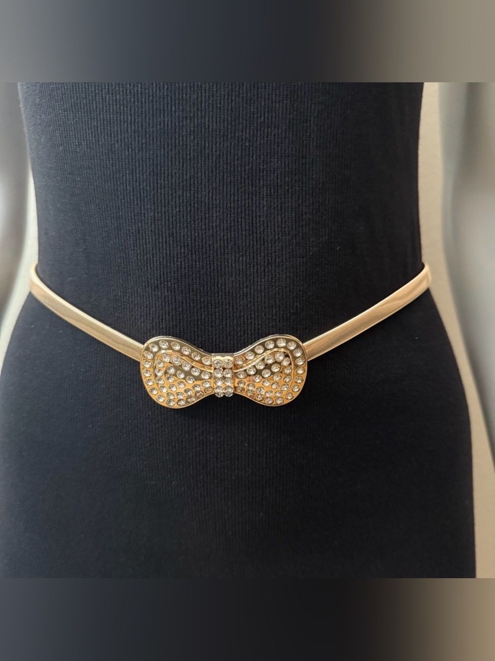 Gold tone metallic bow buckle skinny belt